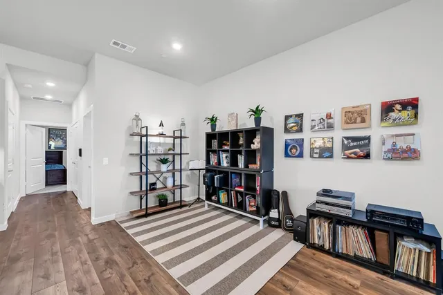 a view of a livingroom with shelves