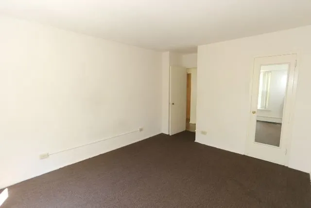 an empty room with a bathroom