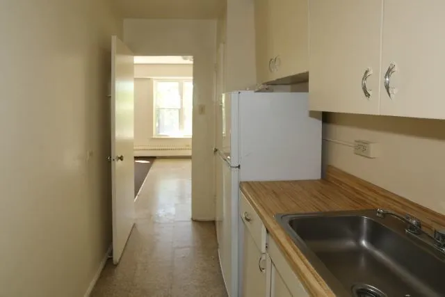 a kitchen that has a sink and a stove