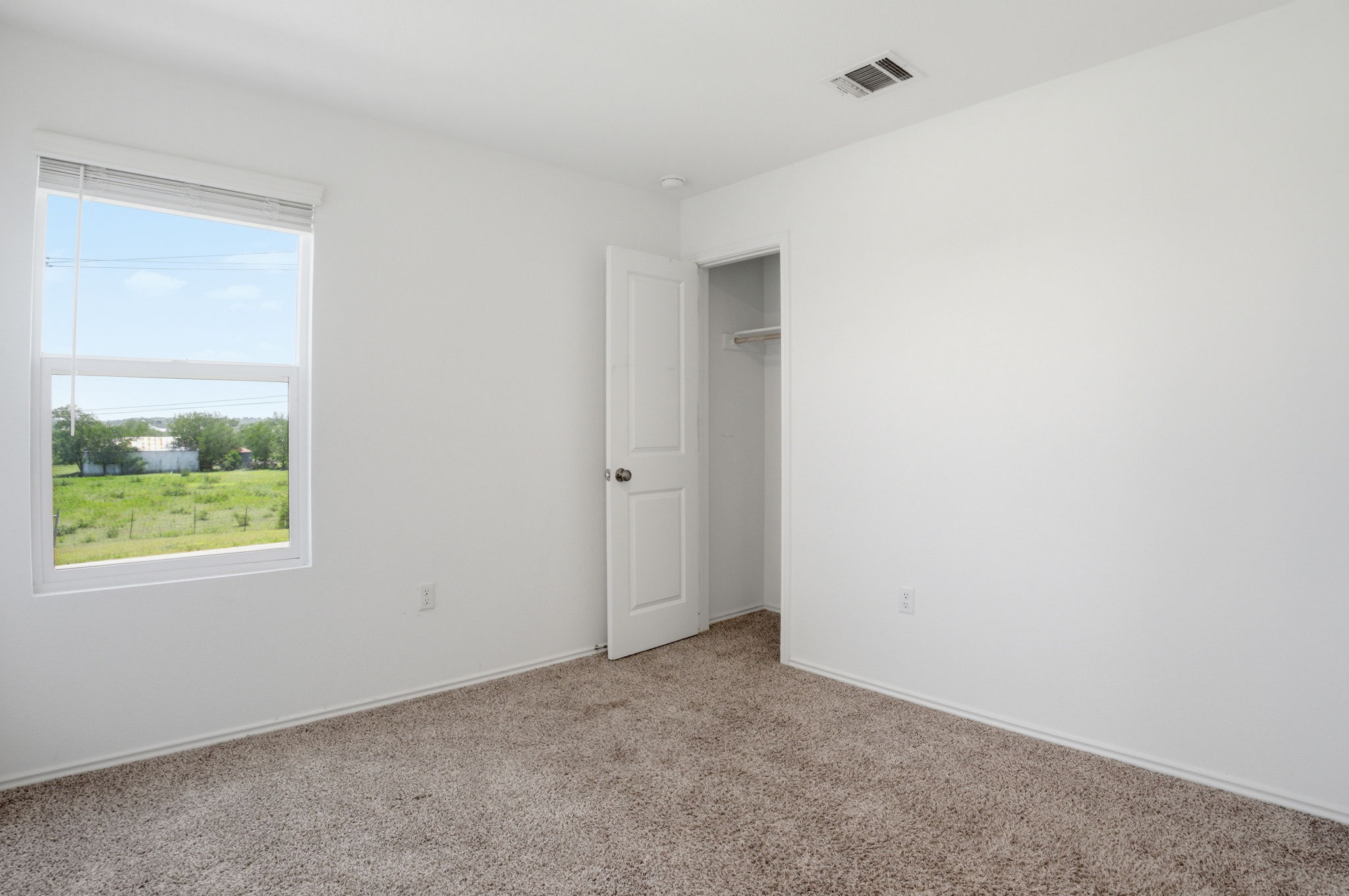 12213 Rising Moon Lane Del Valle, TX 78617 - Photo 10 of 19 an empty room with a window