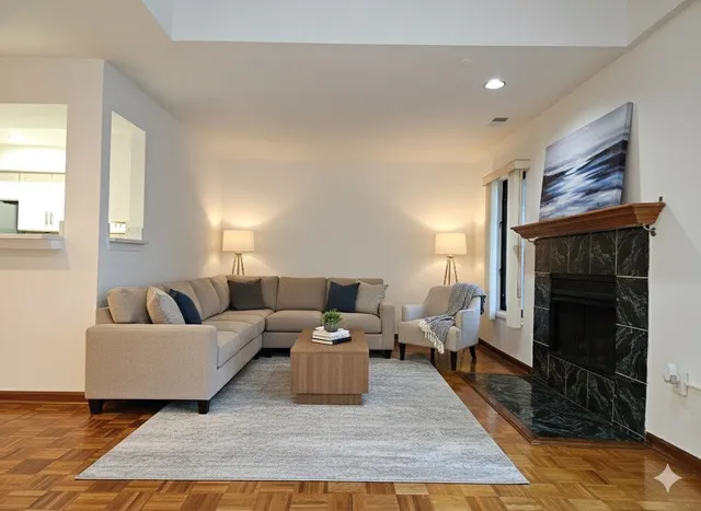 a living room with furniture and a fireplace