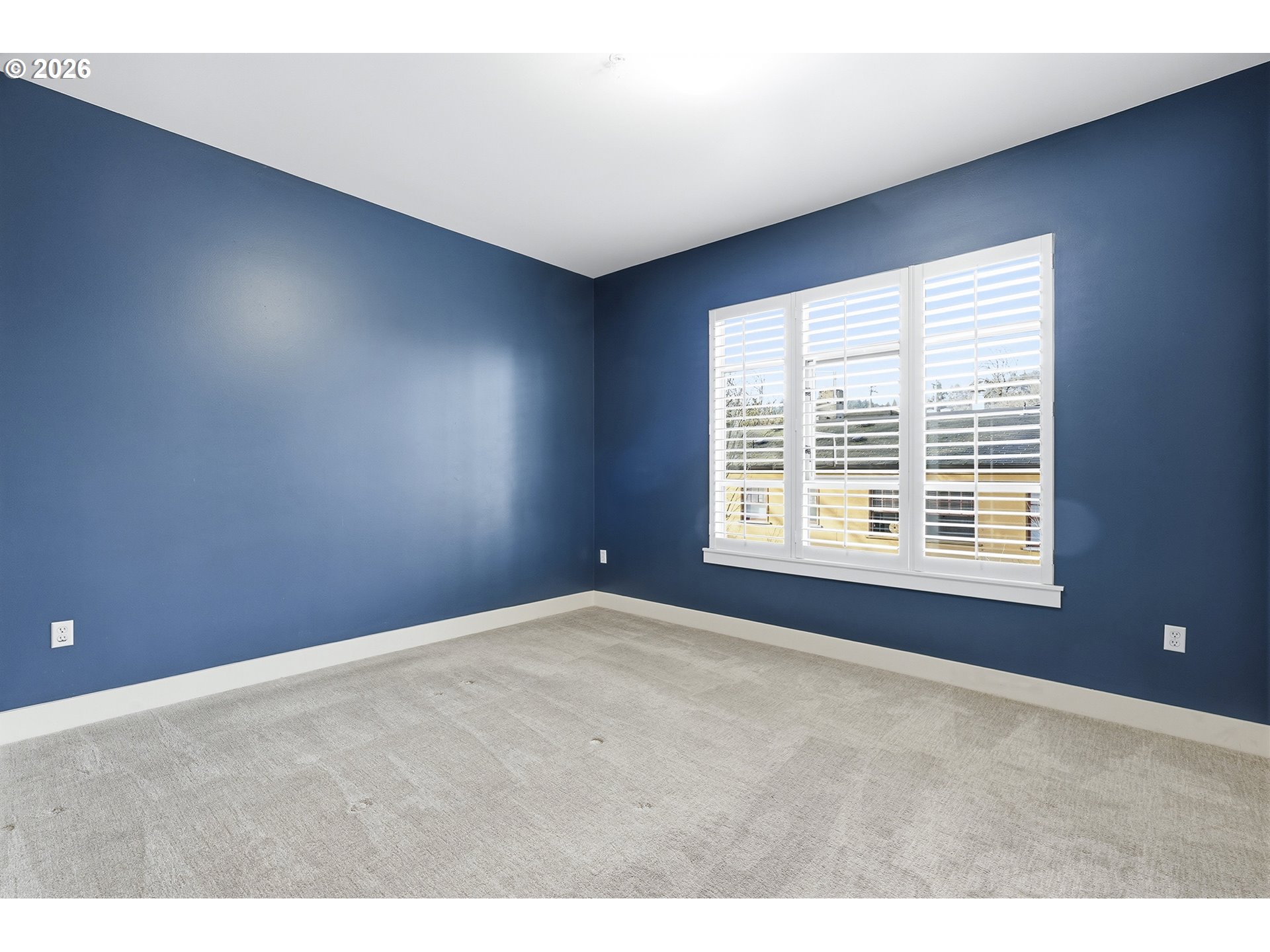 1930 Northwest Irving Street, Unit 302 Portland, OR 97209 - Photo 11 of 26 a view of an empty room with a window
