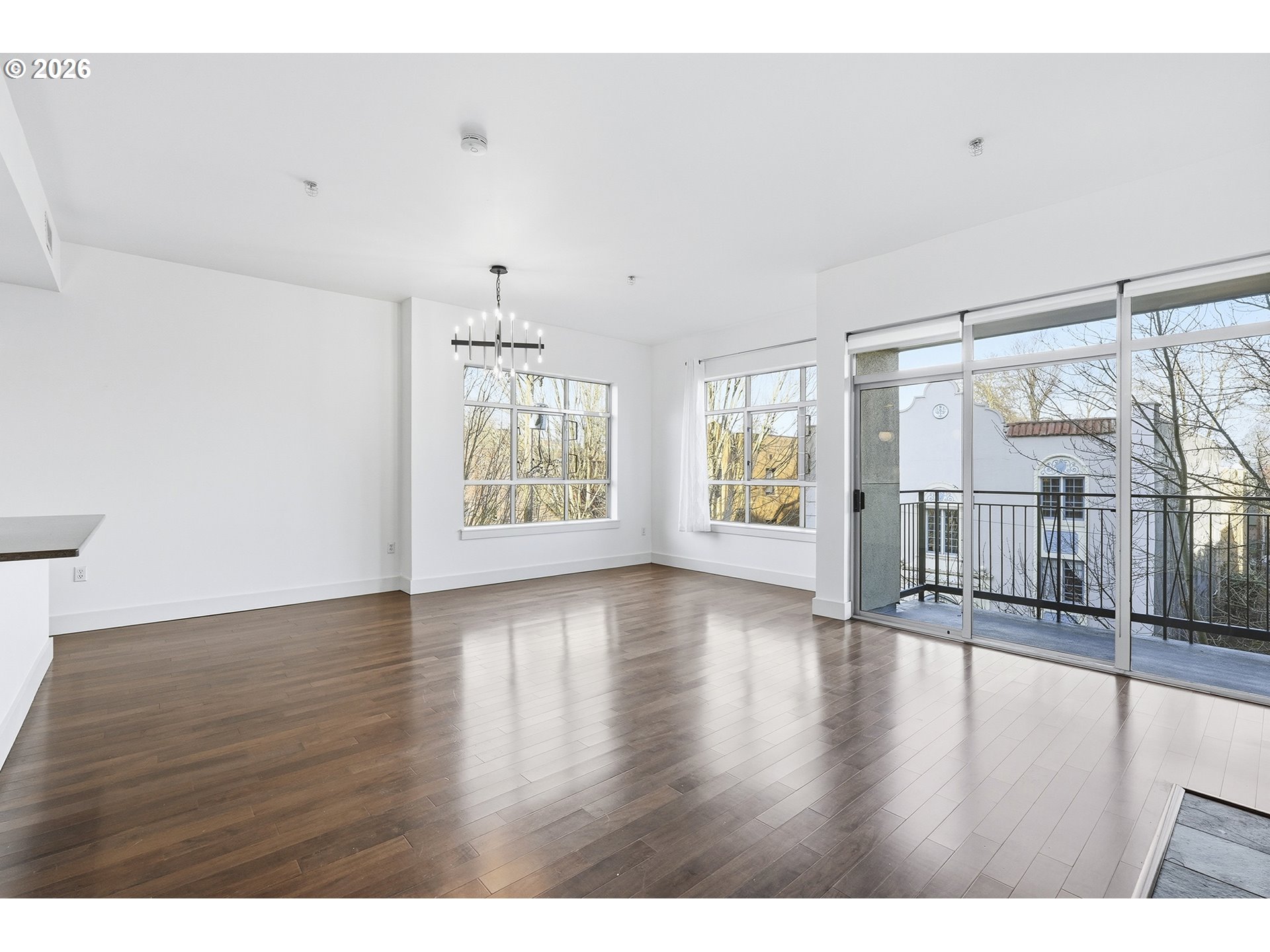 1930 Northwest Irving Street, Unit 302 Portland, OR 97209 - Photo 4 of 26 a view interior of a house with wooden floor and windows