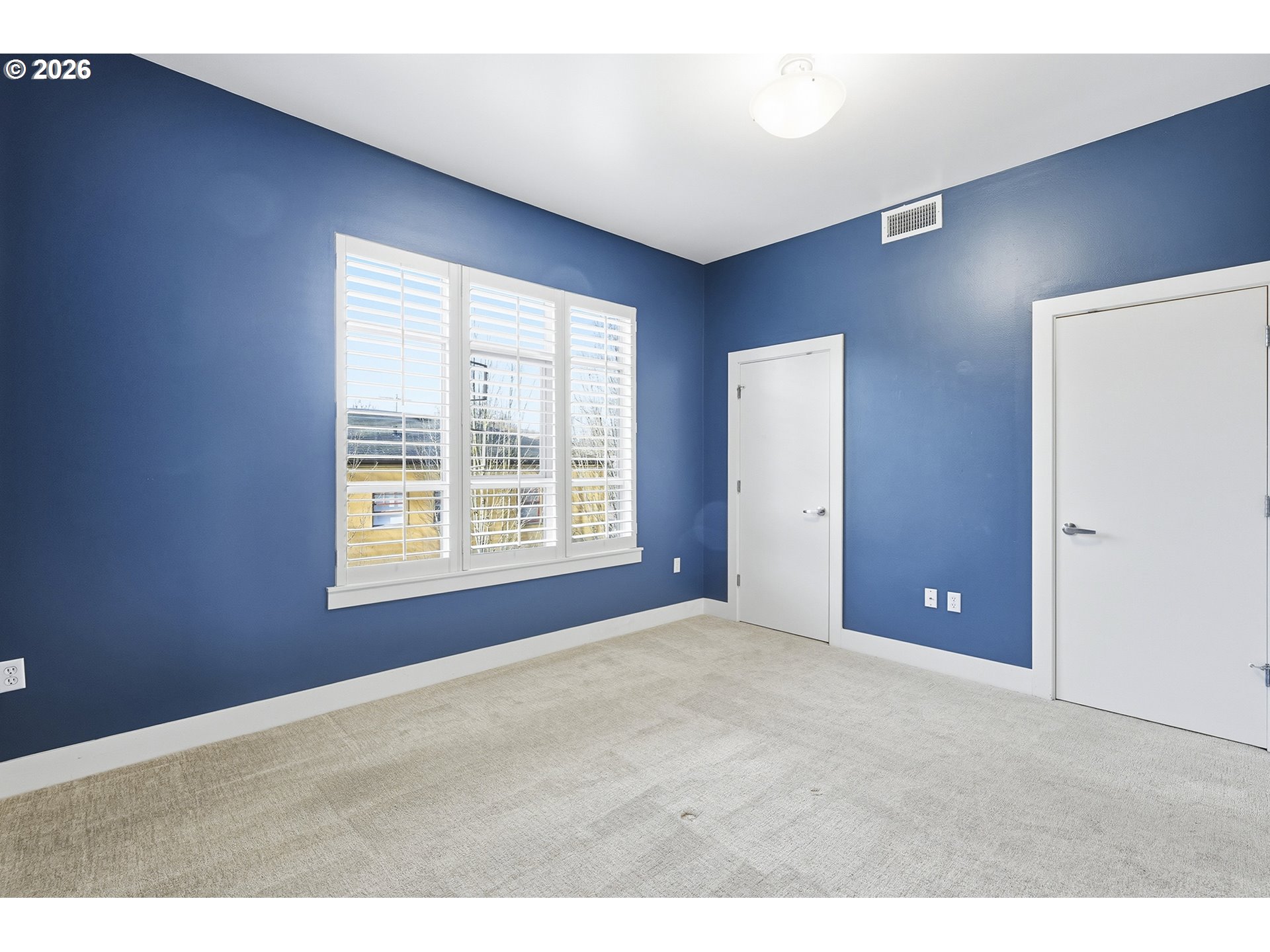 1930 Northwest Irving Street, Unit 302 Portland, OR 97209 - Photo 10 of 26 a view of an empty room with a window