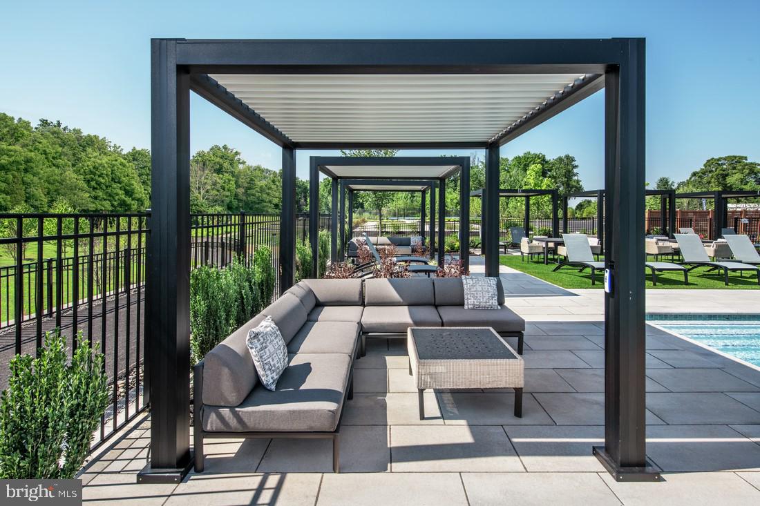202 Gerry Way Ambler, PA 19002 - Photo 12 of 39 a living room with furniture and a floor to ceiling window