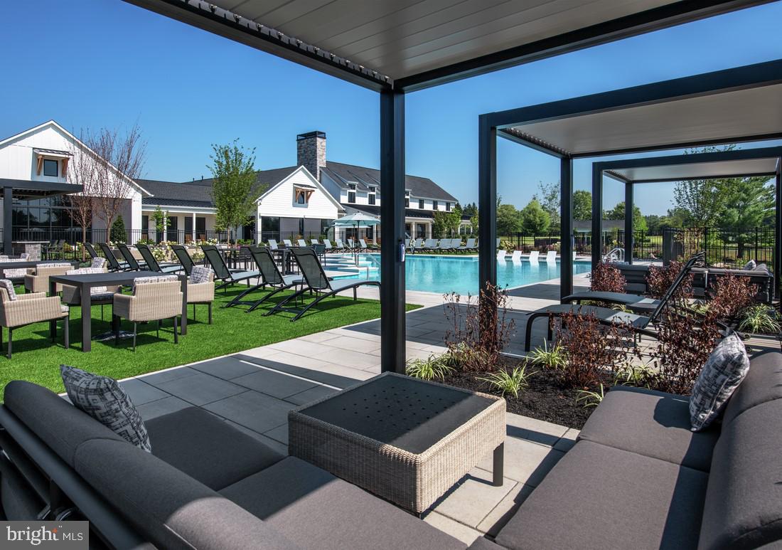 202 Gerry Way Ambler, PA 19002 - Photo 13 of 39 a view of a patio with table and chairs potted plants and floor to ceiling window