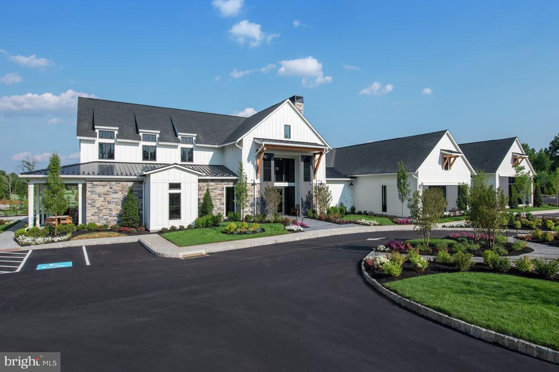 202 Gerry Way Ambler, PA 19002 - Photo 19 of 39 a front view of a house with a yard and garage