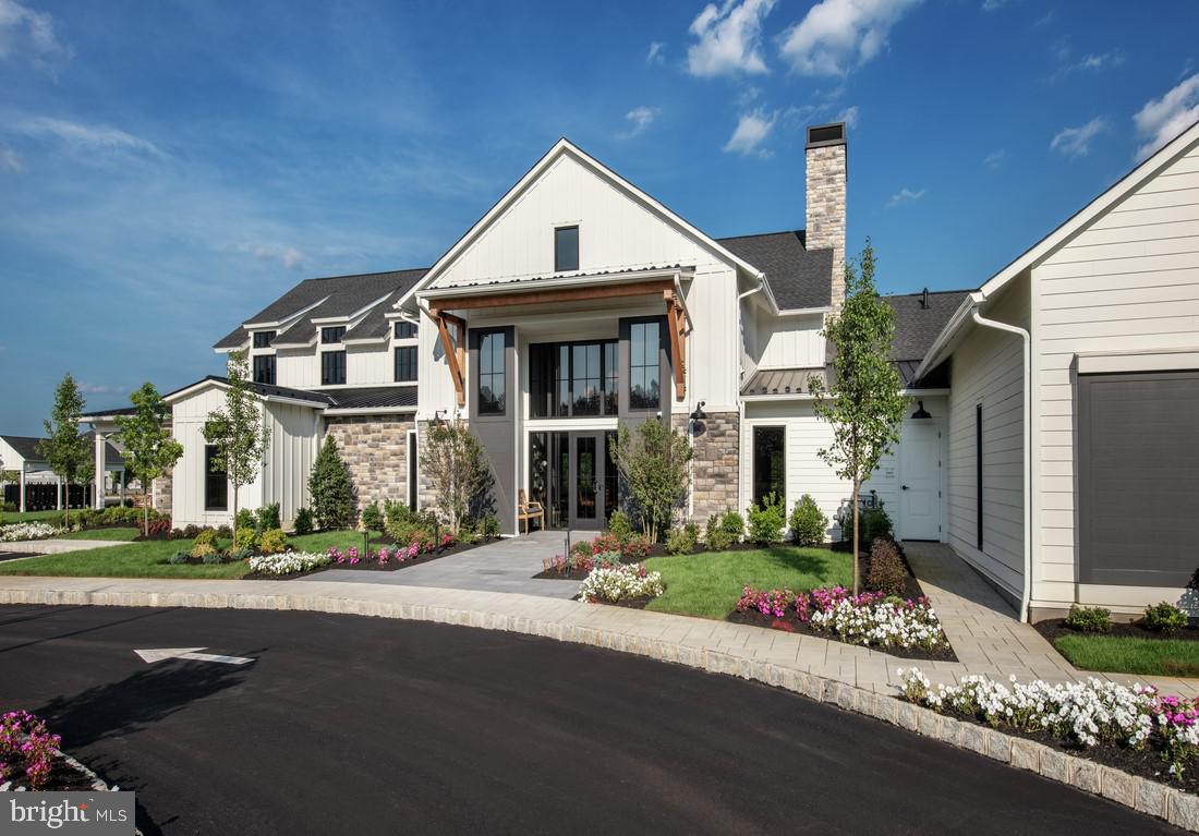 202 Gerry Way Ambler, PA 19002 - Photo 20 of 39 a front view of a house with a garden and plants