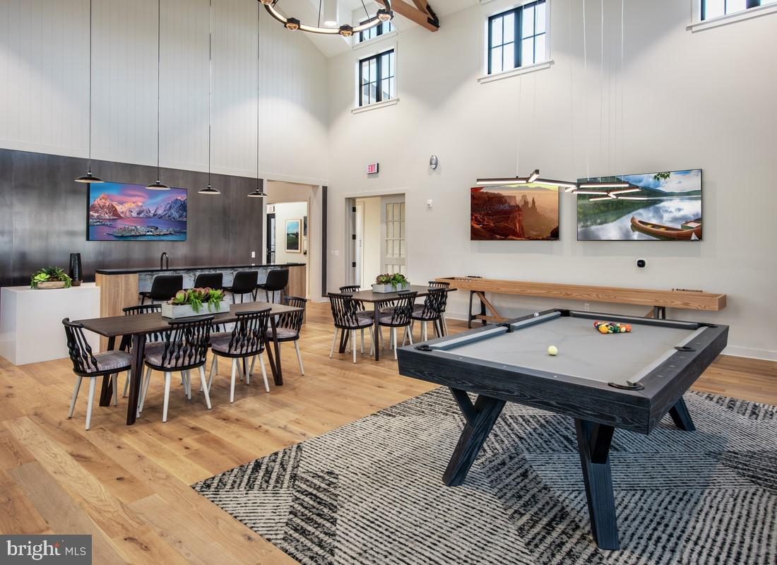 202 Gerry Way Ambler, PA 19002 - Photo 22 of 39 a room with furniture a flat screen tv and a table