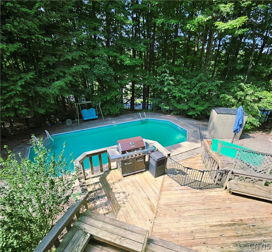 1000 Rail Fence Road Camillus, NY 13031 - Photo 33 of 47 LARGE DECK OVERLOOKING THE HEATED INGROUND POOL..