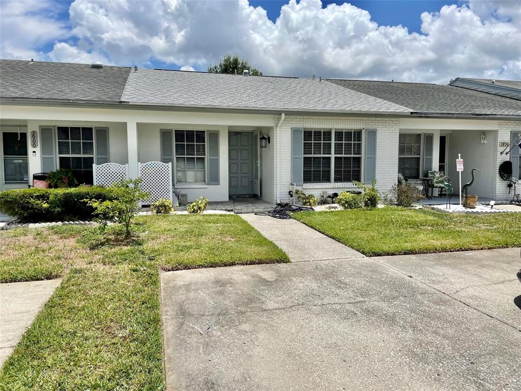 front view of a house with a yard