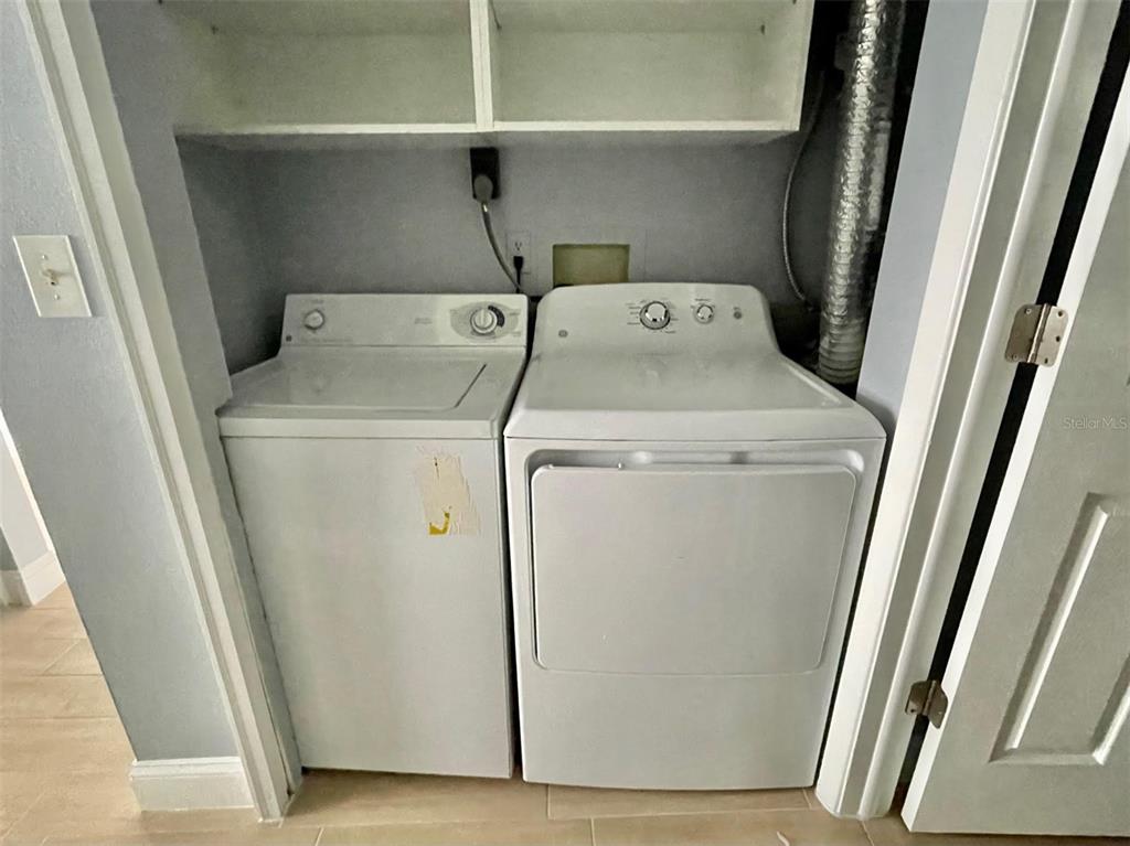 2852 Stillwell Court New Port Richey, FL 34655 - Photo 13 of 13 a utility room with dryer and washer