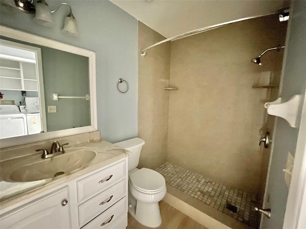 2852 Stillwell Court New Port Richey, FL 34655 - Photo 10 of 13 a bathroom with a sink a toilet and shower