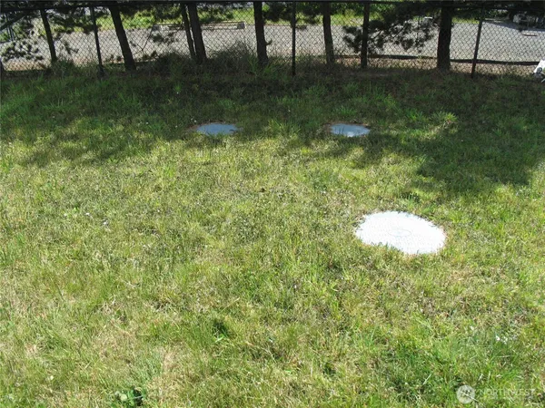 a view of a backyard of the house