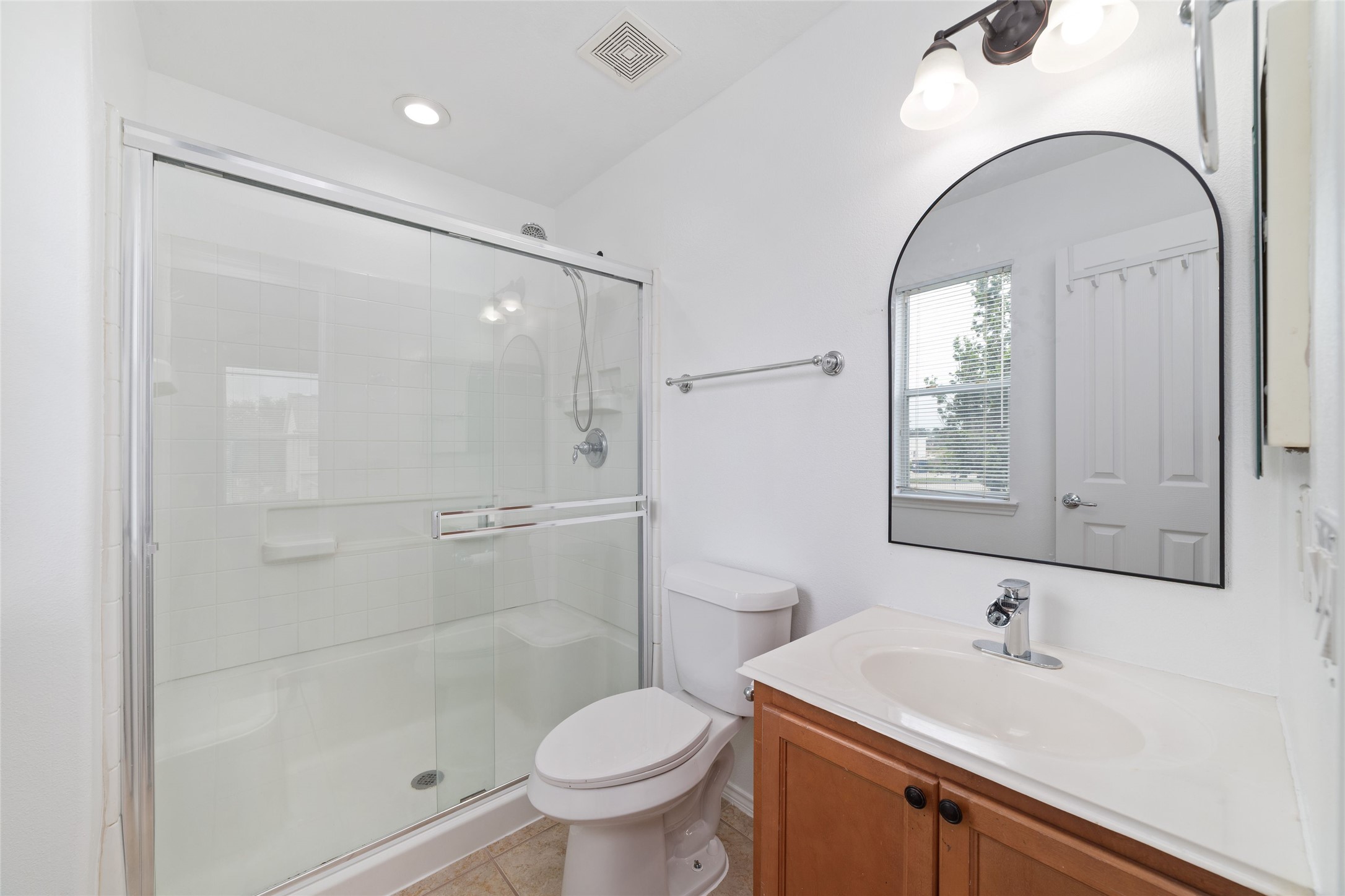 23602 Youpon Lake Lane Spring, TX 77373 - Photo 14 of 21 Primary bathroom with glass-enclosed shower and bright finishes.