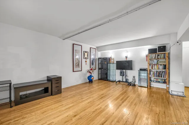 a view of a livingroom with furniture and wooden floor