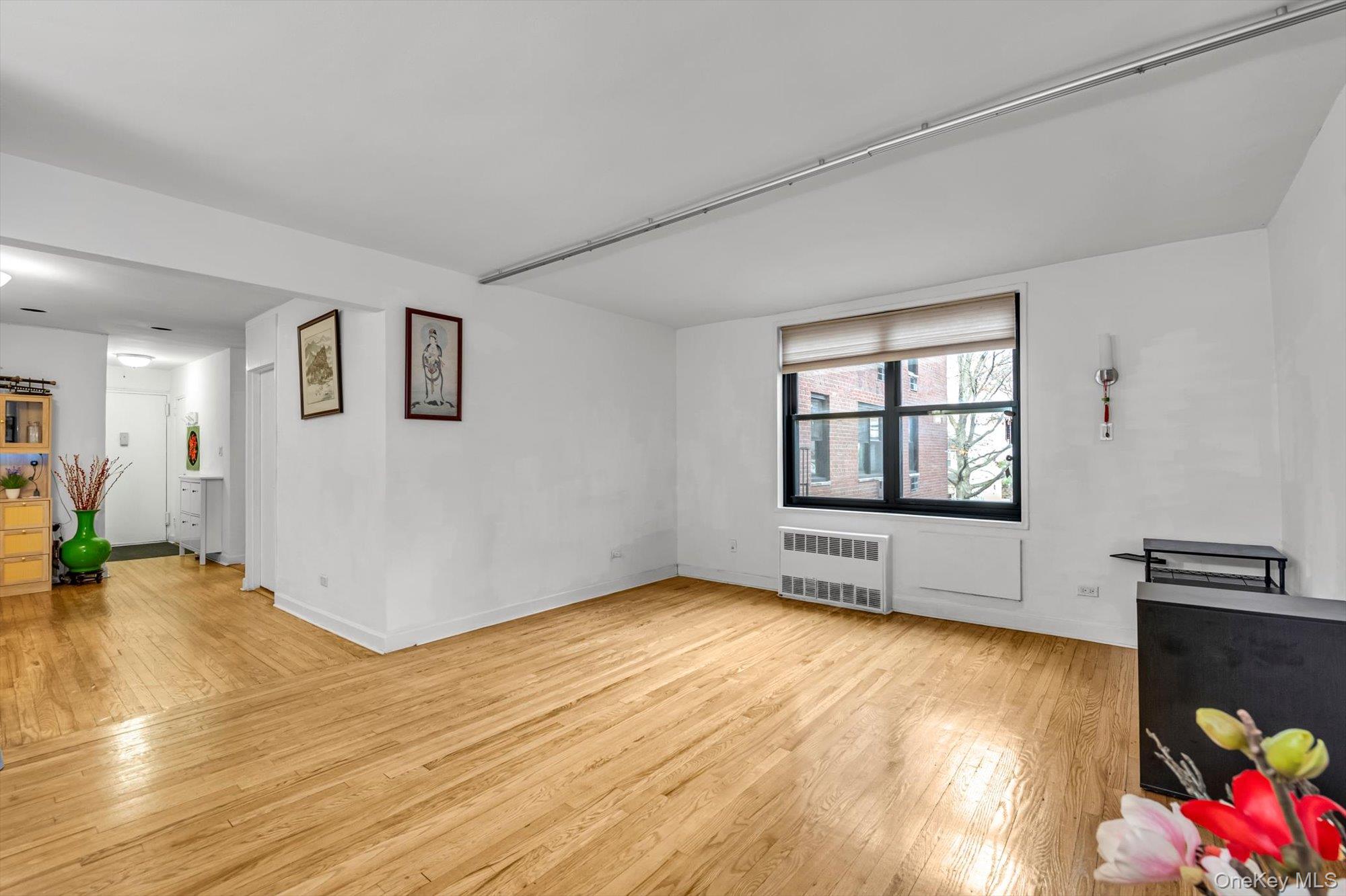 139-15 83rd Avenue, Unit 305 Queens, NY 11435 - Photo 10 of 21 a view of livingroom with hardwood floor and hallway