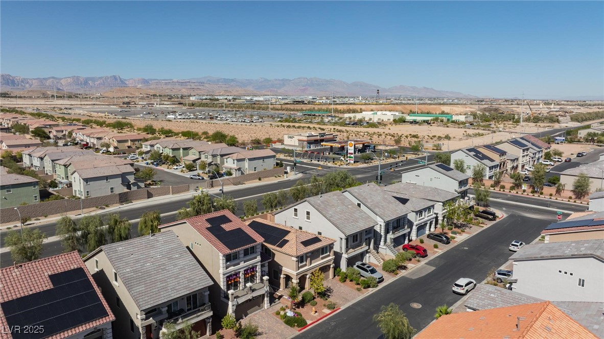 10137 Herons Rise Street Las Vegas, NV 89141 - Photo 6 of 38 Aerial perspective of suburban area featuring a mountainous background