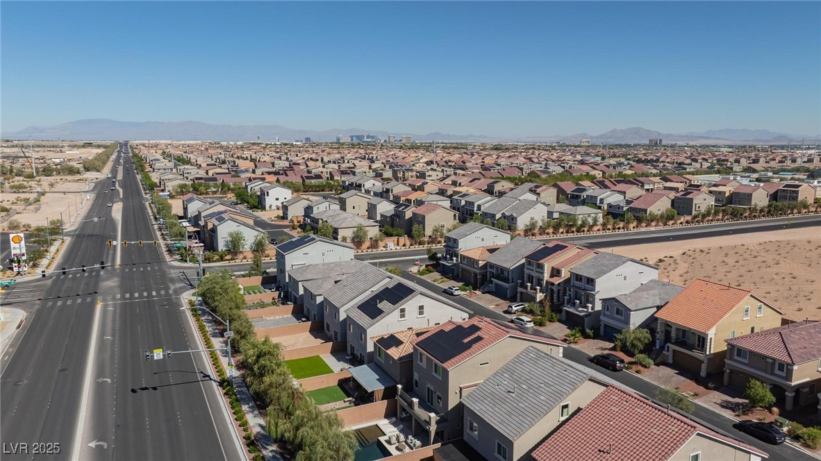 10137 Herons Rise Street Las Vegas, NV 89141 - Photo 7 of 38 Aerial perspective of suburban area with a mountainous background