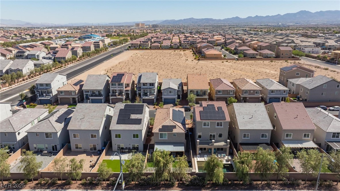 10137 Herons Rise Street Las Vegas, NV 89141 - Photo 8 of 38 Aerial view of residential area featuring a mountain backdrop