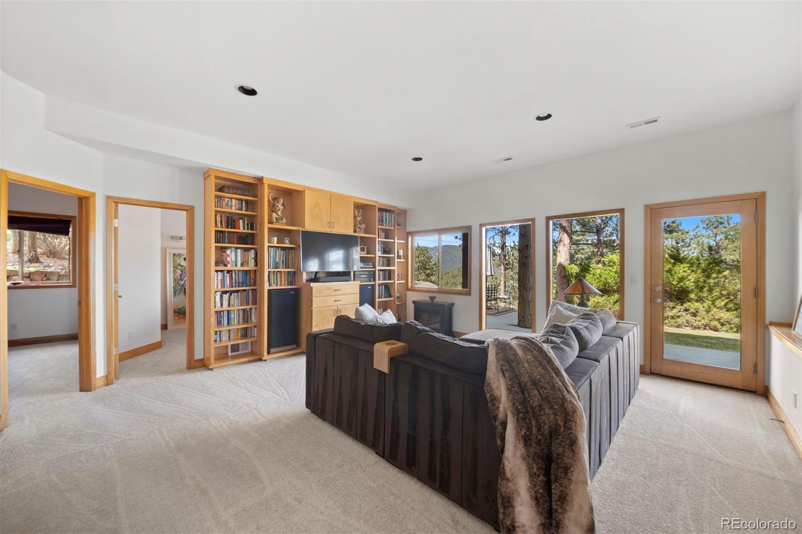 5811 Herzman Drive Evergreen, CO 80439 - Photo 30 of 49 a view of a bedroom with furniture and staircase