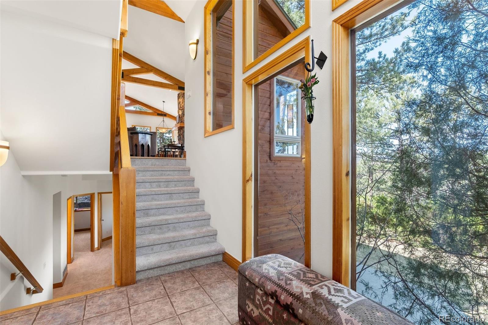 5811 Herzman Drive Evergreen, CO 80439 - Photo 5 of 49 a view of a house with a door and wooden floor