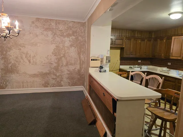 a view of a kitchen with electric appliances