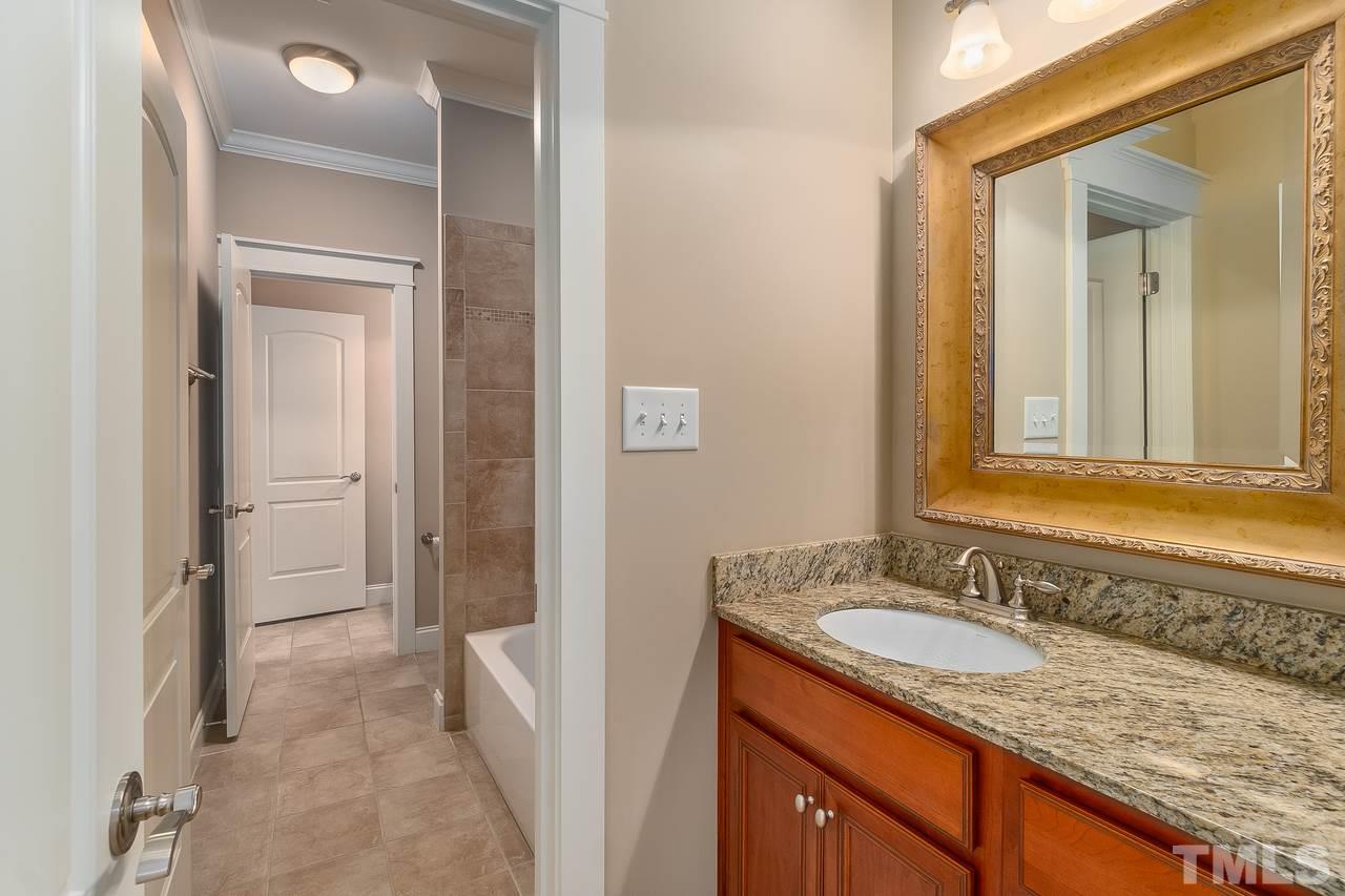 2815 Country Charm Road Raleigh, NC 27614 - Photo 21 of 30 It is between the 4th and 5th bedroom. 2 separate sink rooms with a shared shower and toilet.
