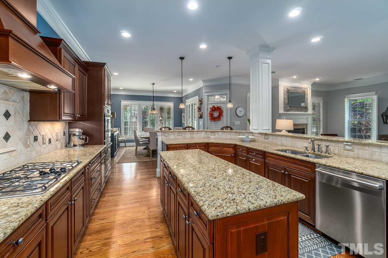 2815 Country Charm Road Raleigh, NC 27614 - Photo 7 of 30 Gas Range, Double Oven, Built in Microwave, True Range Hood, Butlers Pantry, Walk In Pantry, Under cabinet Lighting.