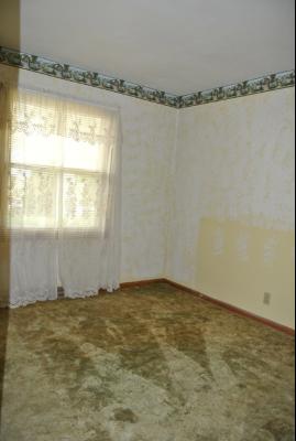 8787 Huber Road Belvidere, IL 61008 - Photo 10 of 16 a view of an empty room with a window
