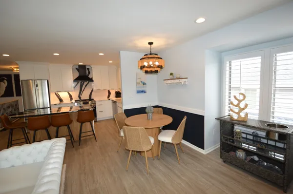 a dining room with furniture and window