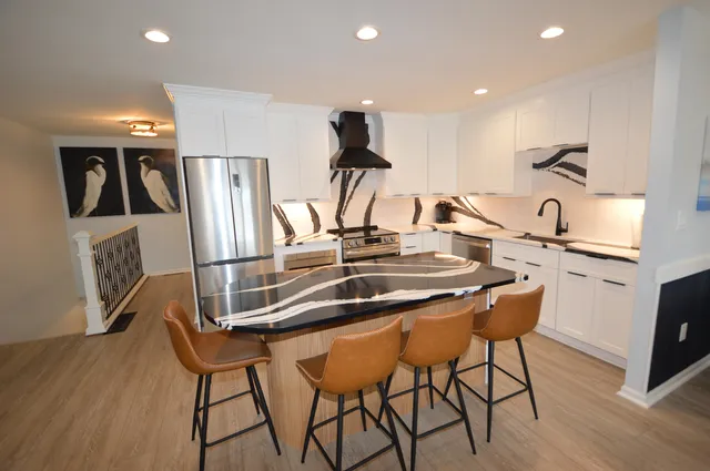 a kitchen with a stove and a refrigerator