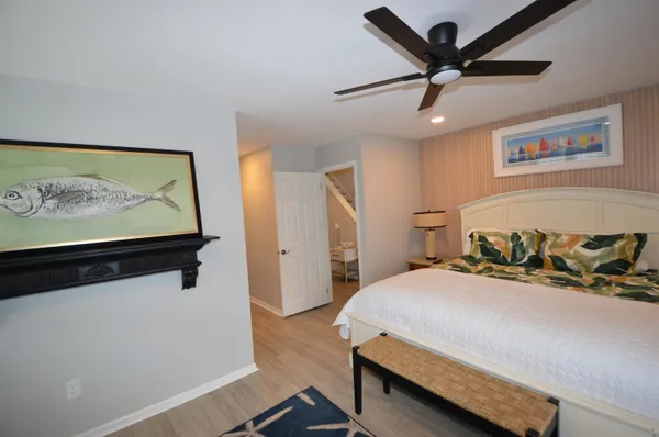 a bed room with a bed and a chandelier