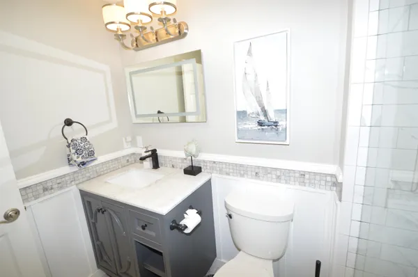 a bathroom with a shower and a toilet
