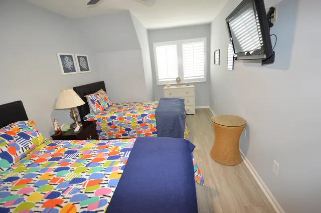 a bedroom with a bed and window