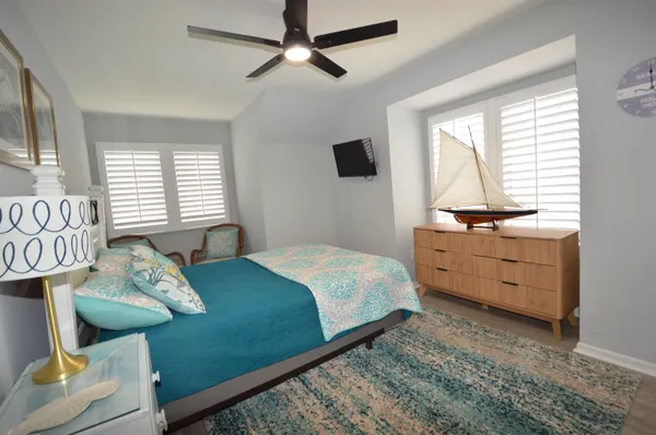 a bedroom with a bed and a dresser