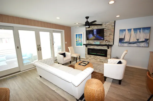 a living room with furniture fireplace and a flat screen tv