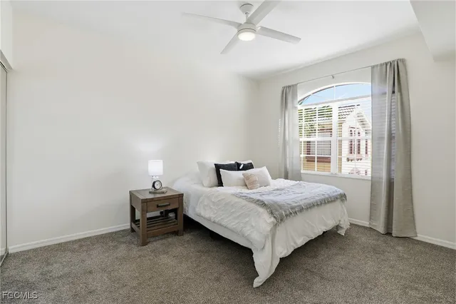 a bedroom with a bed and a night lamp