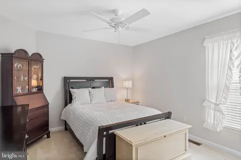 a bed room with a bed and a window