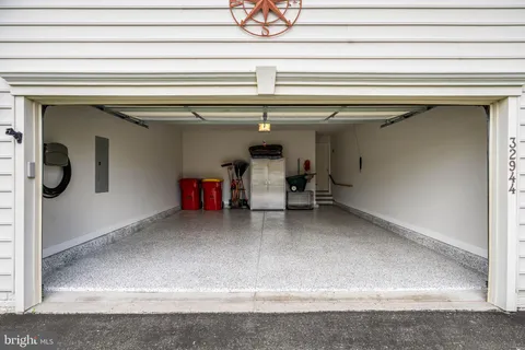 a front view of a house with a yard and green space