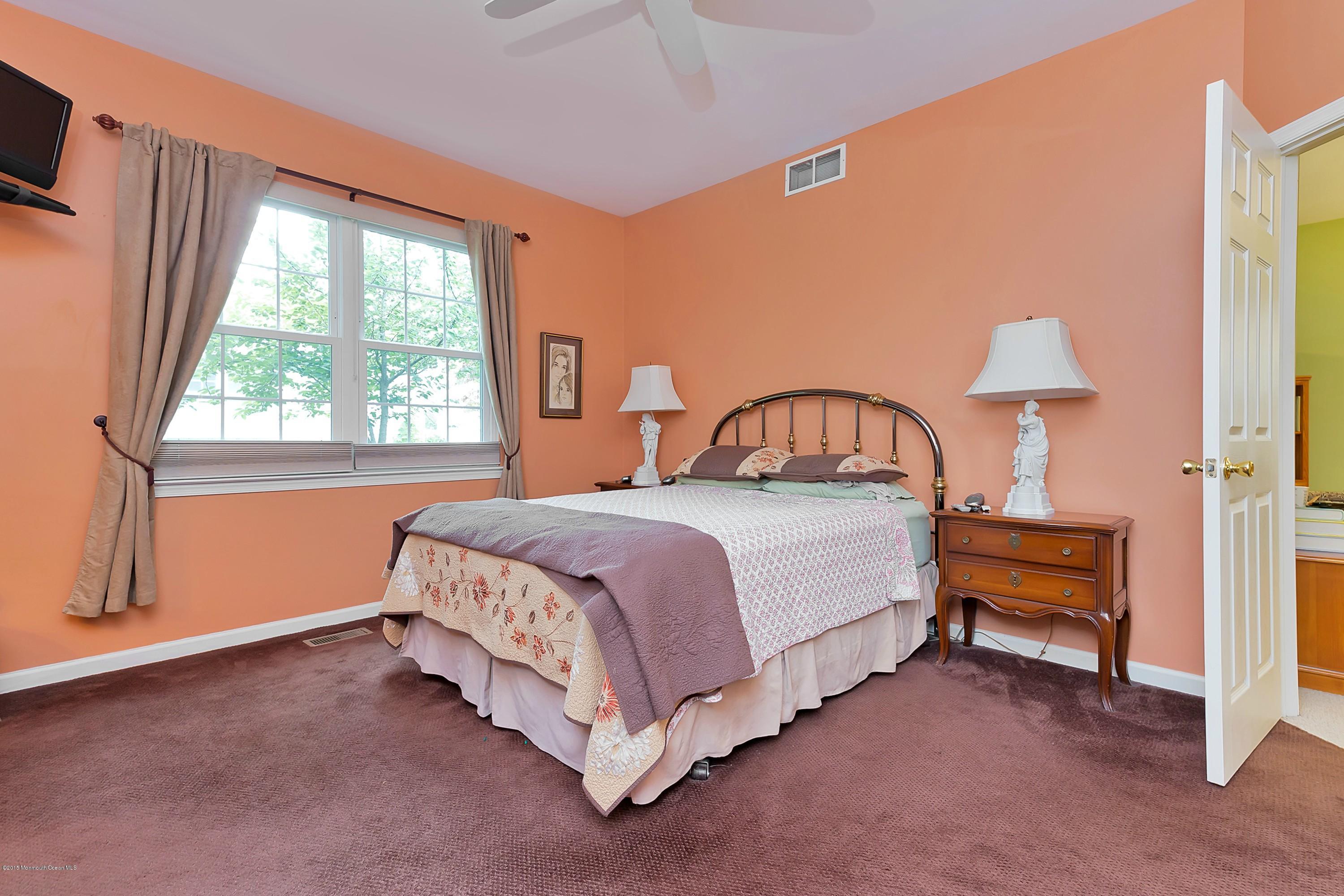 14 Shelley Road Brick, NJ 08724 - Photo 7 of 11 a bedroom with a bed and a window