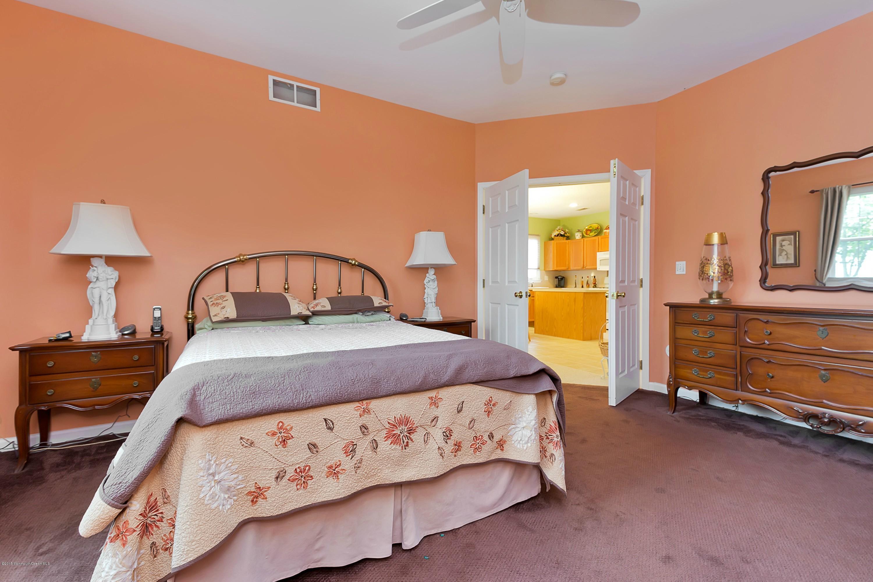 14 Shelley Road Brick, NJ 08724 - Photo 8 of 11 a bedroom with a bed and a table