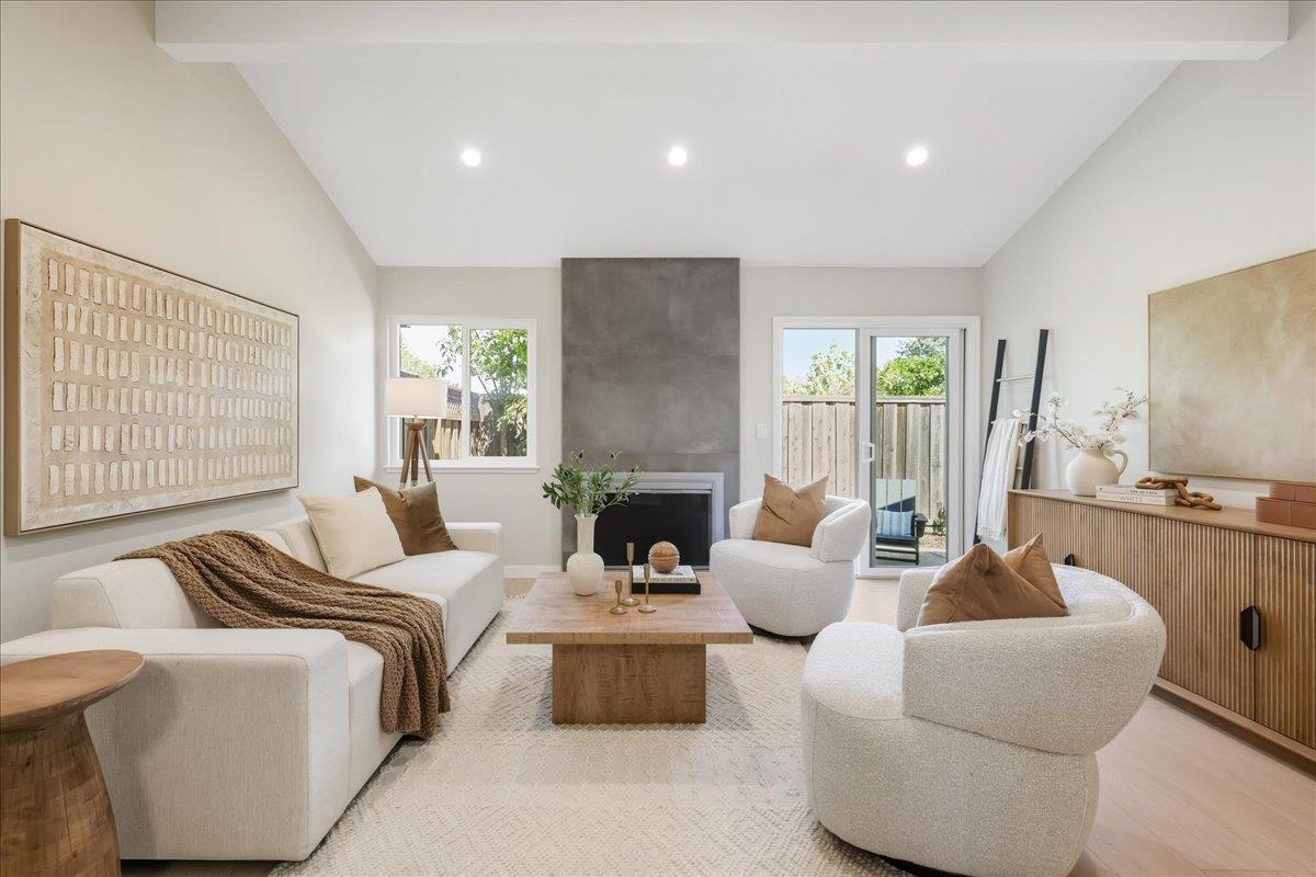 1243 East Fremont Terrace Sunnyvale, CA 94087 - Photo 1 of 1 a living room with fireplace furniture and a large window