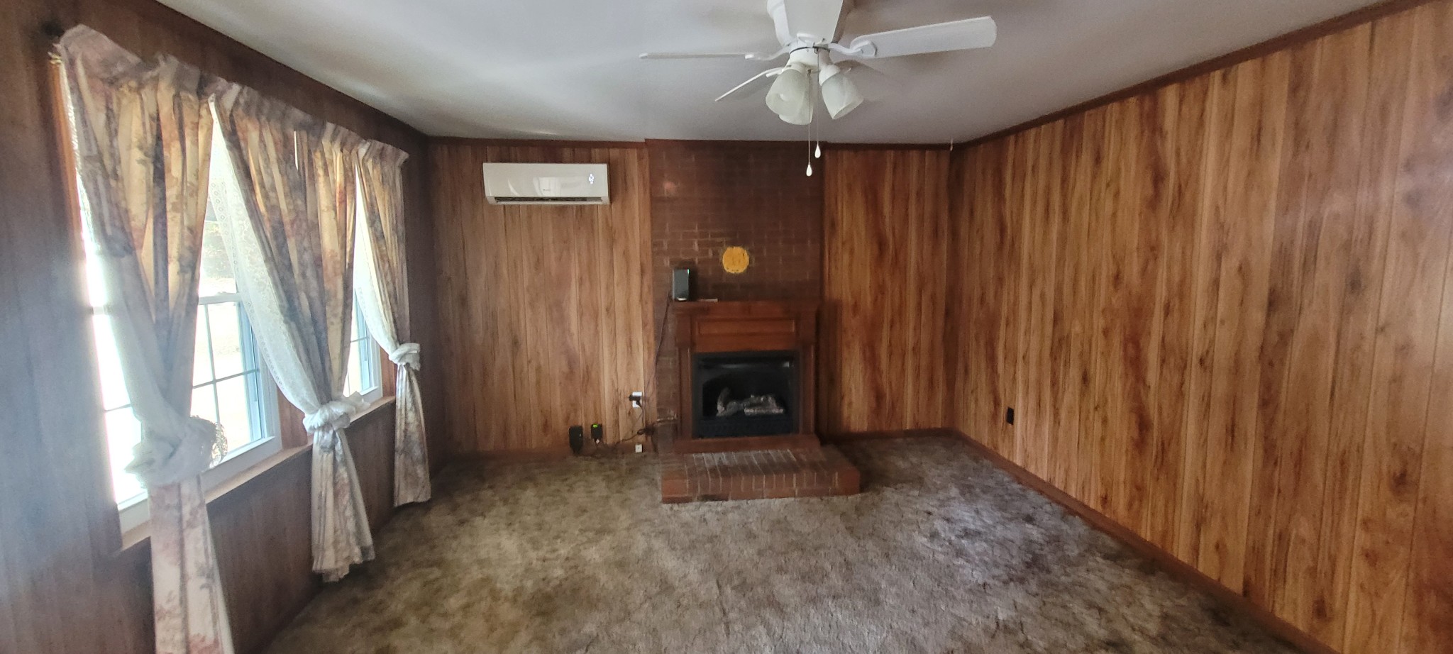 495 Shepherd Hollow Road Indian Mound, TN 37079 - Photo 20 of 30 a view of an empty room with a fireplace and a window