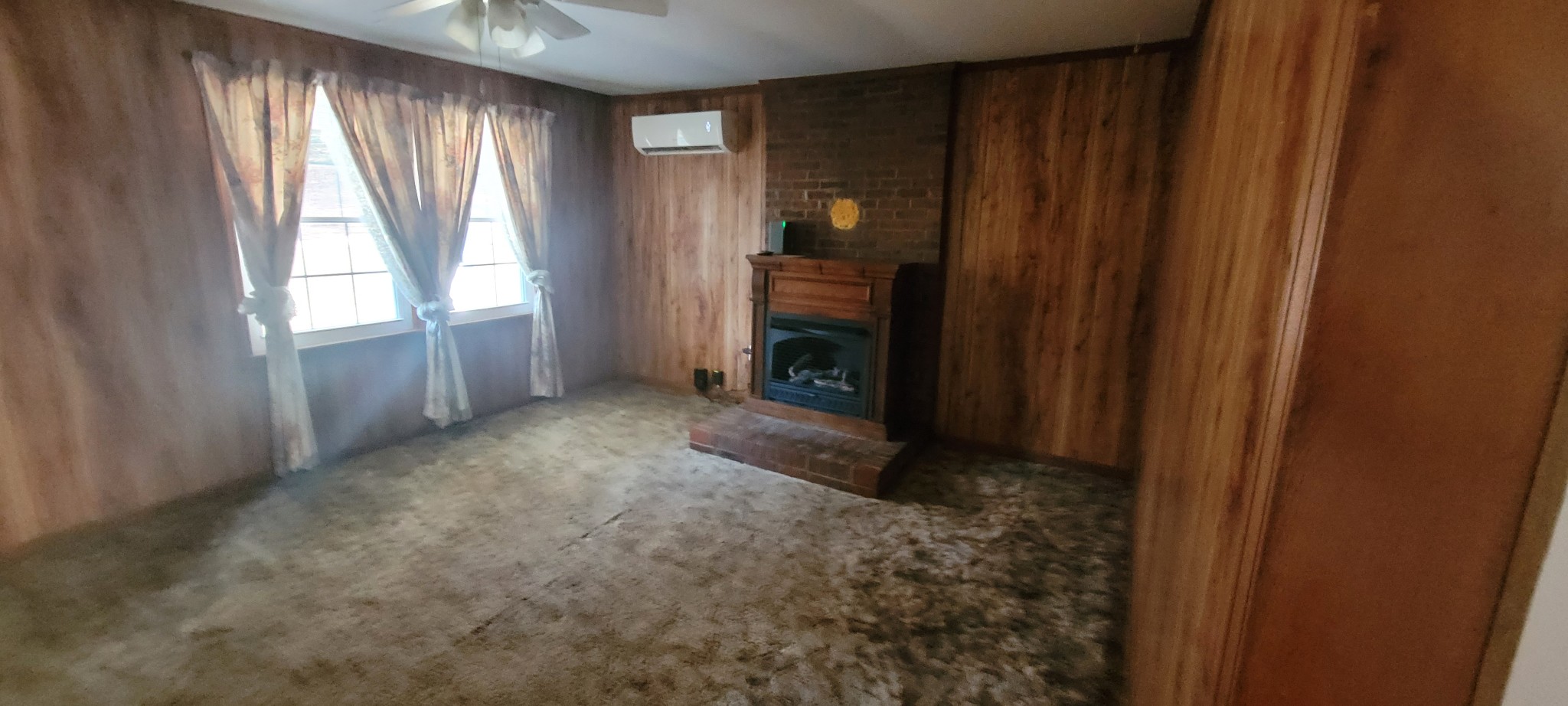 495 Shepherd Hollow Road Indian Mound, TN 37079 - Photo 21 of 30 a view of an empty room with a fireplace and a window