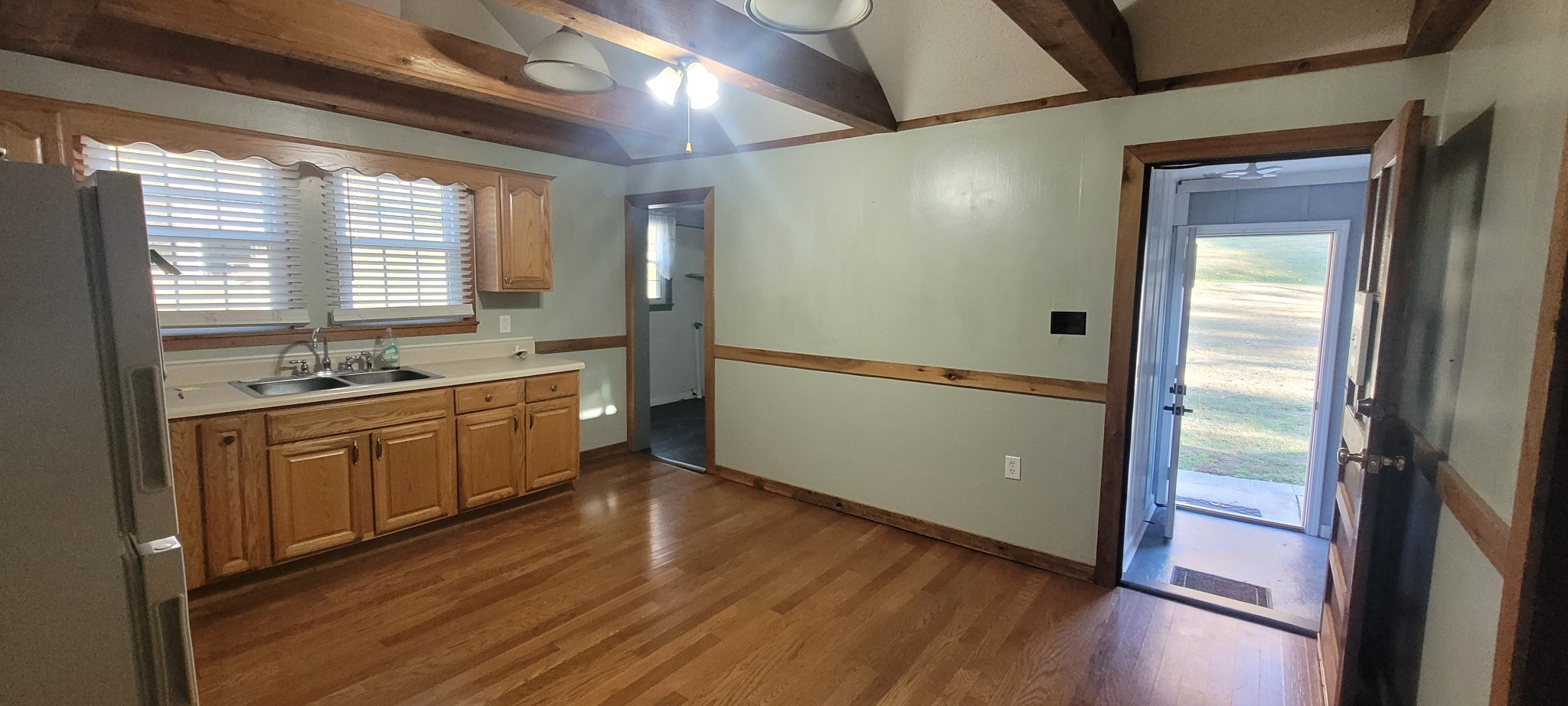 495 Shepherd Hollow Road Indian Mound, TN 37079 - Photo 22 of 30 a large kitchen with kitchen island a large window a sink stainless steel appliances and cabinets