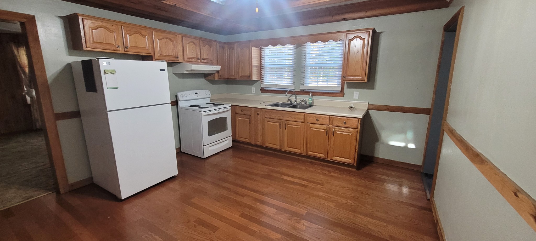 495 Shepherd Hollow Road Indian Mound, TN 37079 - Photo 25 of 30 a kitchen with a refrigerator sink and cabinets