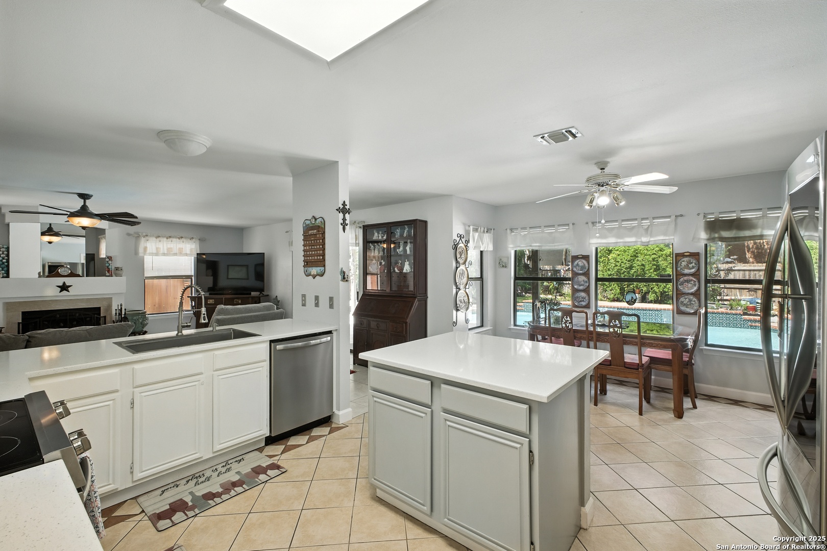 16414 Bulverde Point San Antonio, TX 78247 - Photo 13 of 46 a kitchen with a sink and chairs