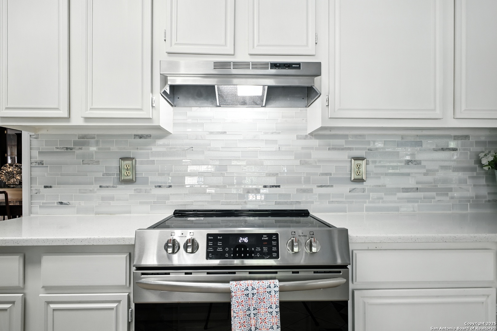 16414 Bulverde Point San Antonio, TX 78247 - Photo 16 of 46 a kitchen with stainless steel appliances granite countertop white cabinets and a stove