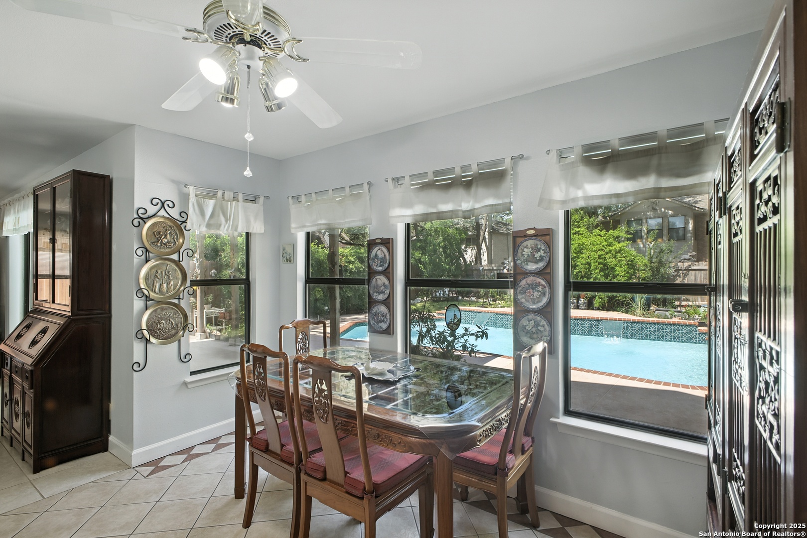 16414 Bulverde Point San Antonio, TX 78247 - Photo 17 of 46 a dining room with furniture a chandelier and window